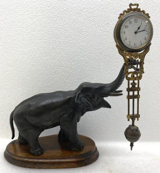 Антикварные каминные часы Junghans Elephant Mystery Swinger